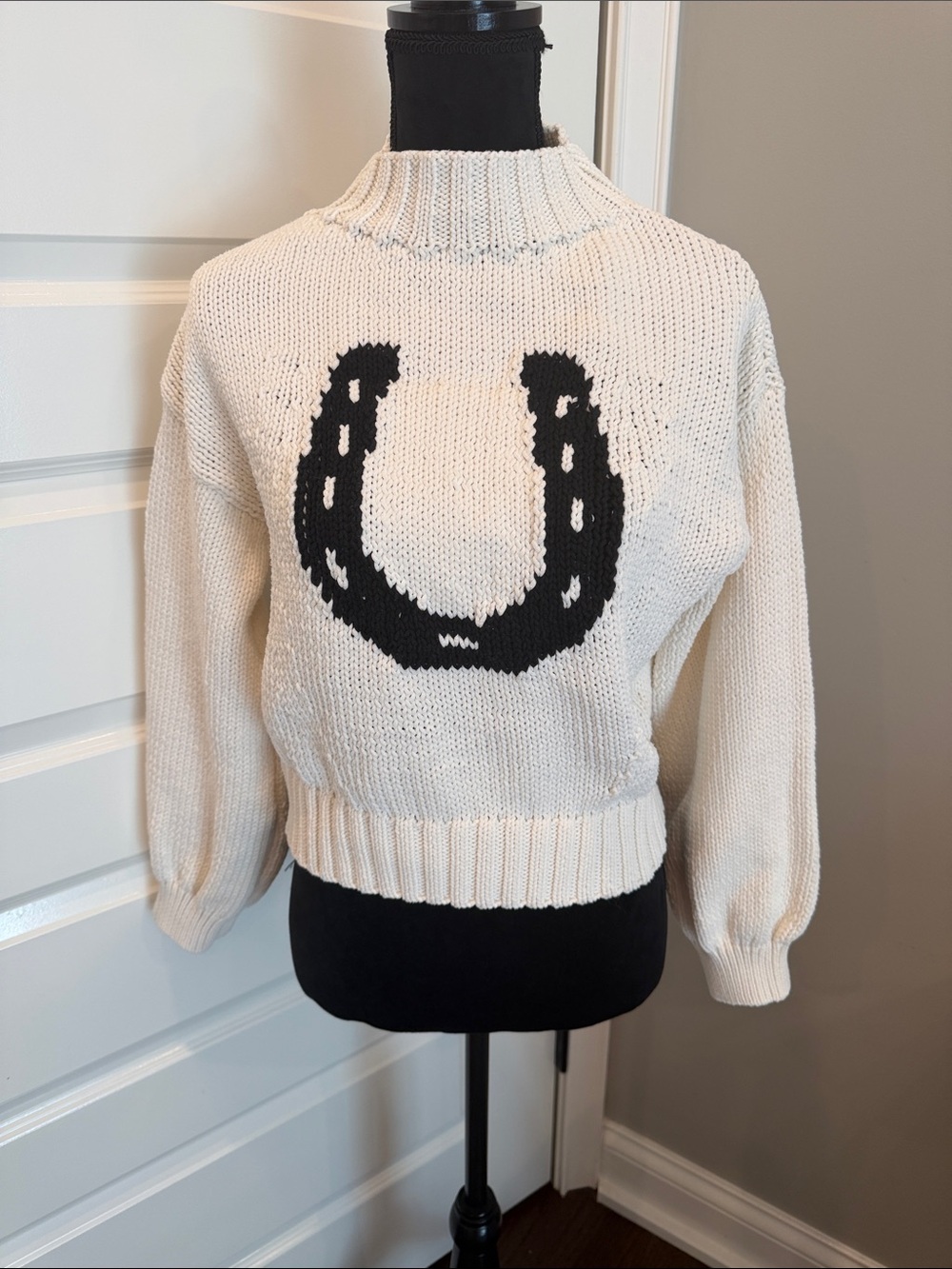 Maeve Cream Knit Turtleneck Sweater with Black Horseshoe